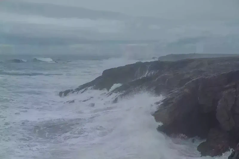 Waves crashing on cliffs