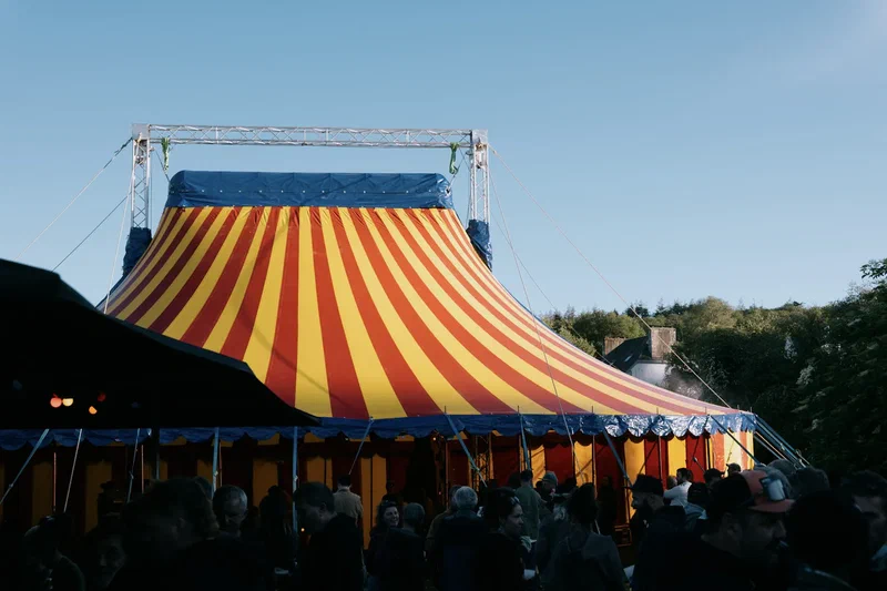 Red and yellow circus tent at a festival