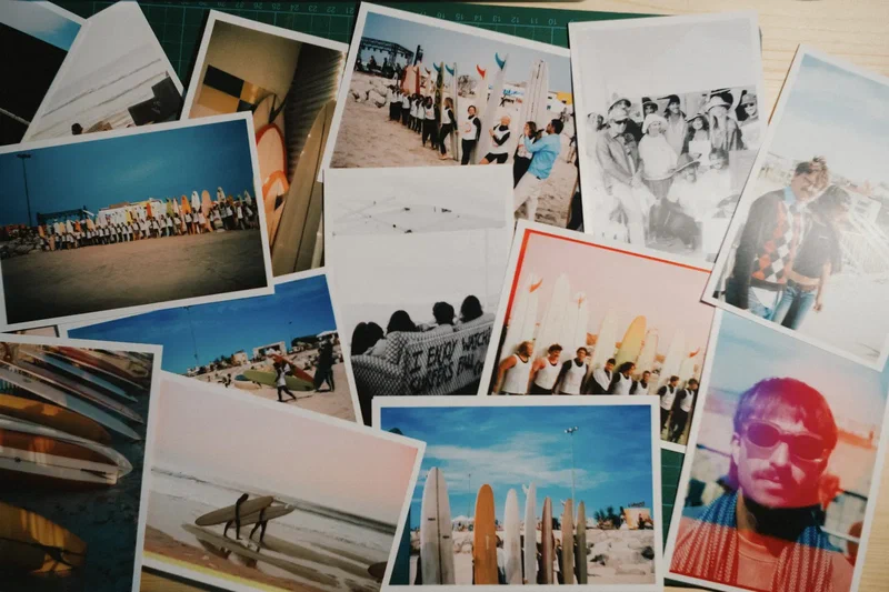 Spread of colour photo prints from a surf trip